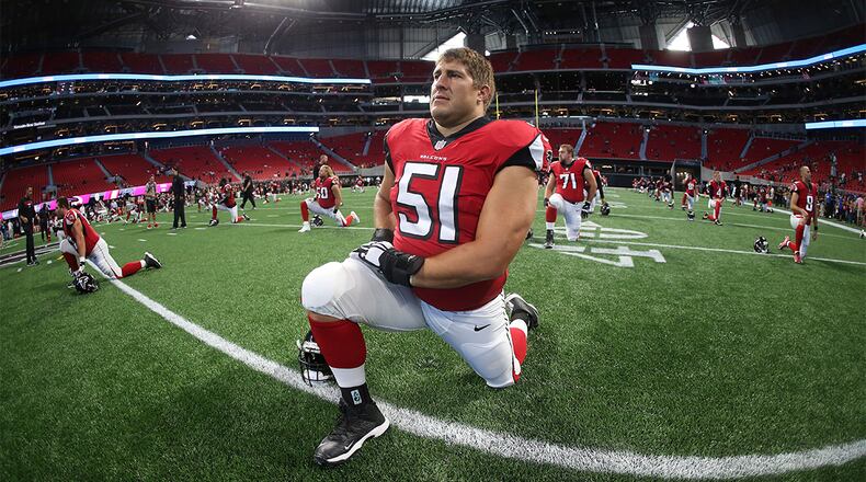 Falcons center Alex Mack (51) warms up before an exhibition game against the Jacksonville Jaguars, Thursday, Aug. 31, 2017, at Mercedes-Benz Stadium in Atlanta.