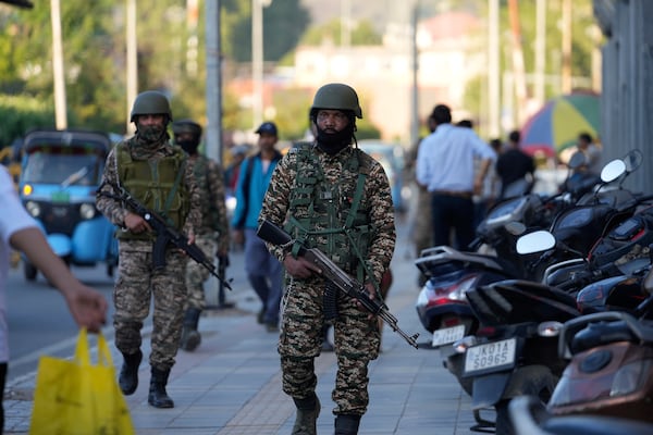 Indian paramilitary soldiers patrol as they guard at a busy market in Srinagar, Indian controlled Kashmir, Tuesday, April 29, 2025. (AP Photo/Mukhtar Khan)