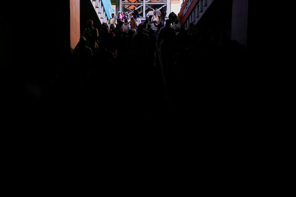 Spectators walk out of the Madrid Open tennis tournament venue during a general blackout in Madrid, Monday, April 28, 2025. (AP Photo/Manu Fernandez)