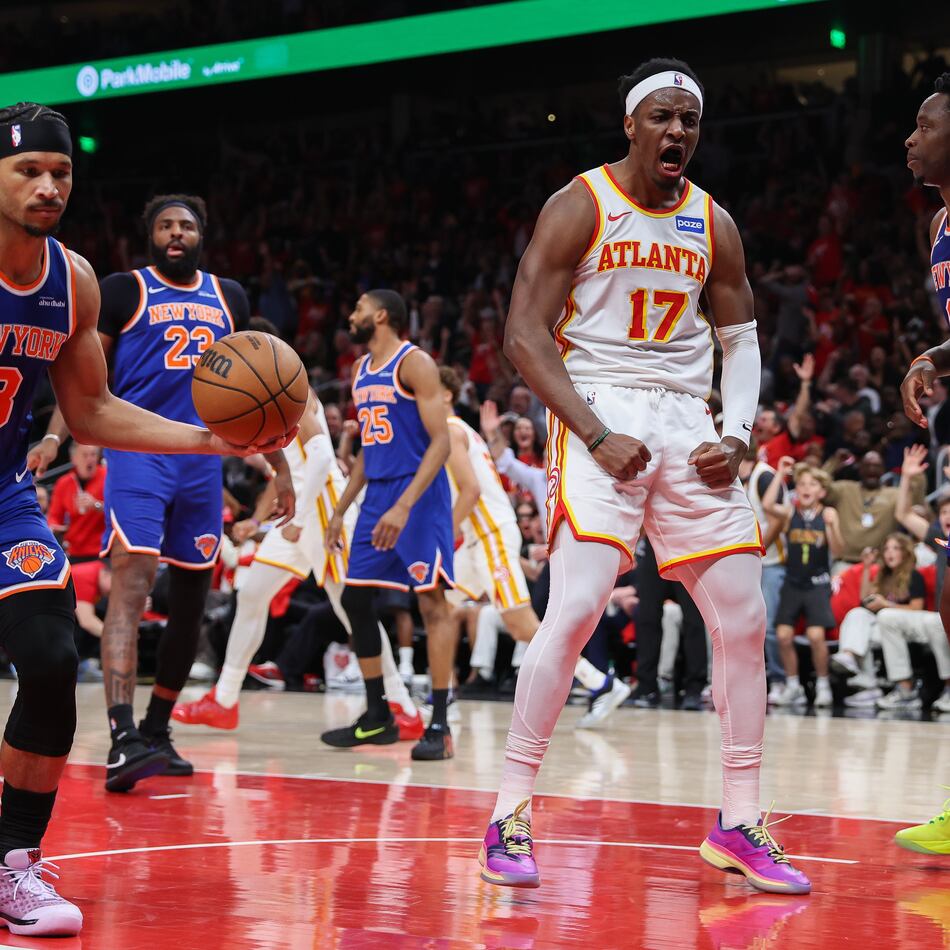 Atlanta Hawks forward Onyeka Okongwu (17) reacts after a dunk against New York Knicks guard Josh Hart (3) and forward OG Anunoby (8) during the first half in Game 3 of a first-round NBA playoffs basketball series, Thursday, April 23, 2026, in Atlanta. (AP Photo/Colin Hubbard)