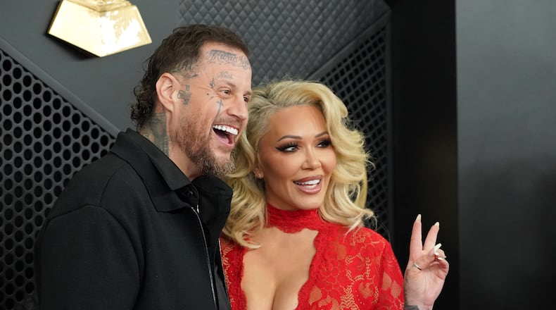 FILE - Jelly Roll, left, and Bunnie XO arrive at the 68th annual Grammy Awards, Feb. 1, 2026, in Los Angeles. (Photo by Jordan Strauss/Invision/AP, File)