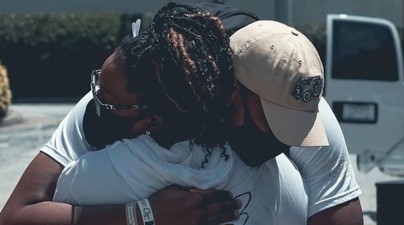 Georgia Tech freshman defensive end Jared Ivey gives his mother Tracey a hug as she got ready to leave after setting up his dorm room July 5, 2020. (Photo courtesy Tracey Ivey)