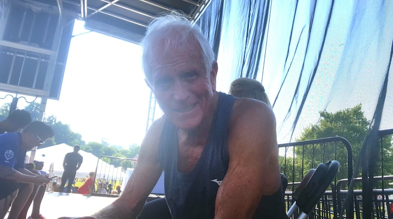 Bill Thorn, resident of Tyrone, sits on stage after running his 47th Atlanta Journal-Constitution Peachtree Road Race on July 4, 2016. (Jaylon Thompson/jaylon.thompson@ajc.com)