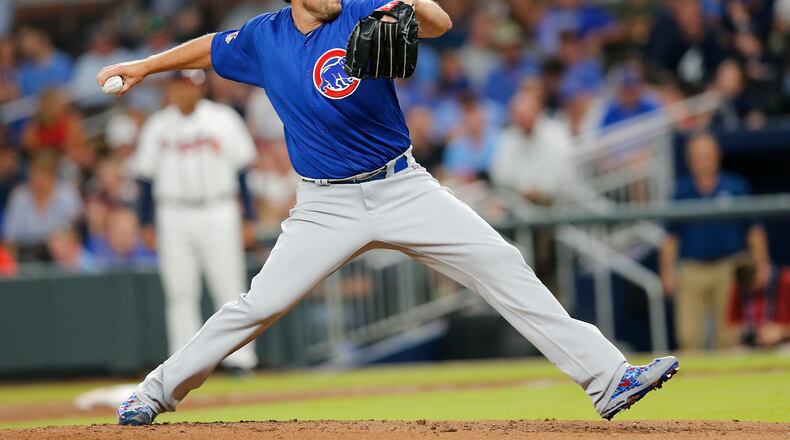 Chicago Cubs starting pitcher John Lackey (41) works int ether first inning of a baseball game against the Atlanta Braves Tuesday, July 18, 2017, in Atlanta. (AP Photo/John Bazemore)