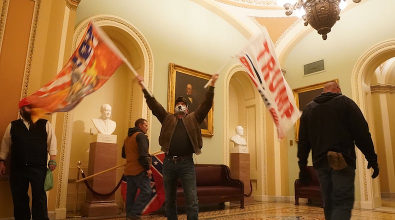 People protesting the presidential election results inside the Capitol in Washington on Wednesday, Jan. 6, 2020. The Capitol building was placed on lockdown, with senators and members of the House locked inside their chambers, as Congress began debating President-elect Joe Biden’s victory. President Trump addressed supporters near the White House before protesters marched to Capitol Hill. (Erin Schaff/The New York Times)