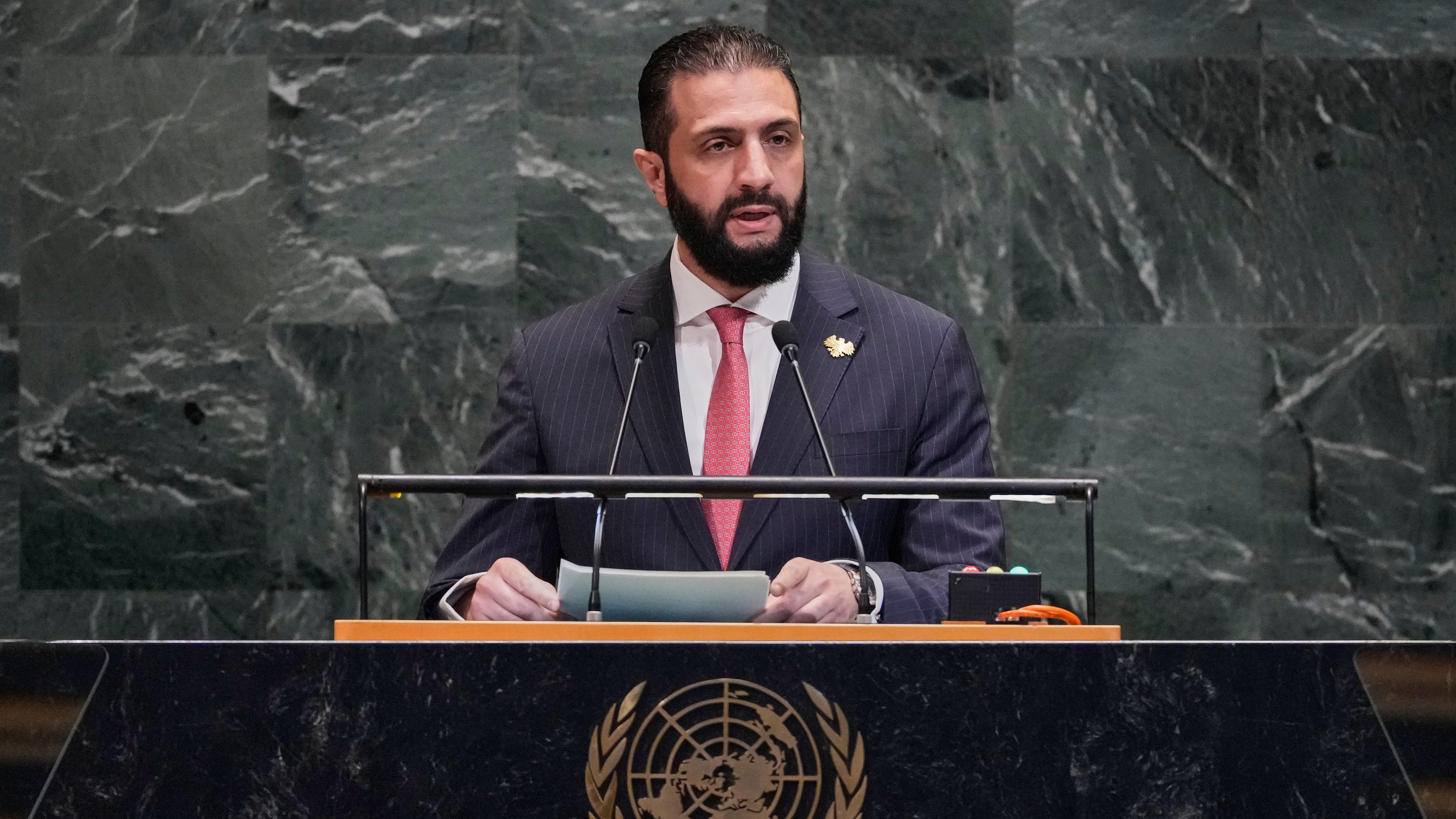 Syria interim President Ahmad Al-Sharaa addresses the 80th session of the United Nations General Assembly, Wednesday, Sept. 24, 2025. (AP Photo/Richard Drew)