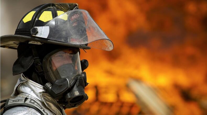 Firefighters were able to rescue one of two dogs trapped in a burning house near Chattanooga on Sunday.