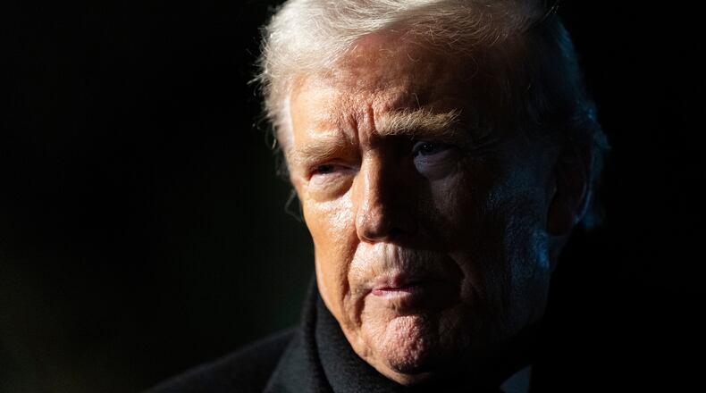 FILE - President Donald Trump speaks before departing on Marine One from the South Lawn of the White House, Jan. 20, 2026, in Washington. (AP Photo/Alex Brandon, File)