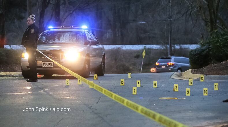 Shell casings are scattered outside the Brockett Place Condominiums, where police believe the man was shot.