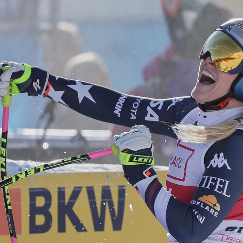 United States' Lindsey Vonn celebrates at the finish area of an alpine ski, women's World Cup downhill in St. Moritz, Switzerland, Friday Dec.12, 2025. (AP Photo/Luciano Bisi)