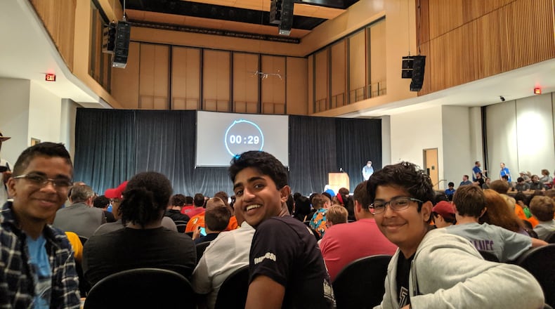 Alpharetta High School students (from left) Varun Kashyap, 14, Nikhil Dasari, 15, and Rishab Seshadri, 15, were seconds away Saturday from the big reveal for this year’s FIRST Tech Challenge, a robotics competition founded by Dean Kamen, known for, among other things, inventing the Segway. (Photo: Ty Tagami/AJC)