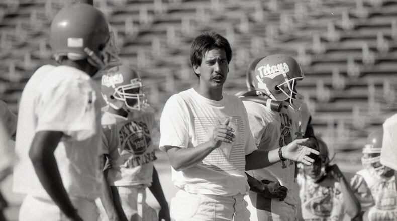 Skyline High School football coach John Beam talks to players at Skyline High School in Oakland, Calif., on Sept. 5, 1989. (Deanne Fitzmaurice/San Francisco Chronicle via AP)