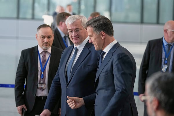 NATO Secretary General Mark Rutte, center right, speaks with Ukraine's Foreign Minister Andrii Sybiha prior to a media statement at NATO headquarters in Brussels, Thursday, April 3, 2025. (AP Photo/Virginia Mayo)