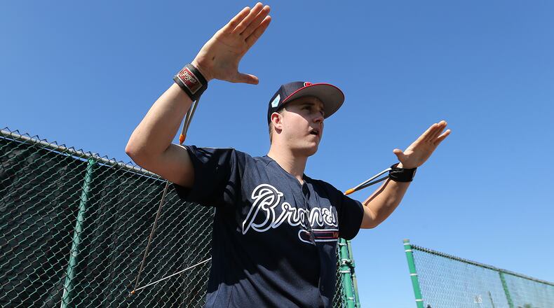 Braves pitcher Tucker Davidson loosens up his arms before pitching in the bullpen Sunday, Feb. 17, 2019, at the ESPN Wide World of Sports Complex in Lake Buena Vista, Fla.
