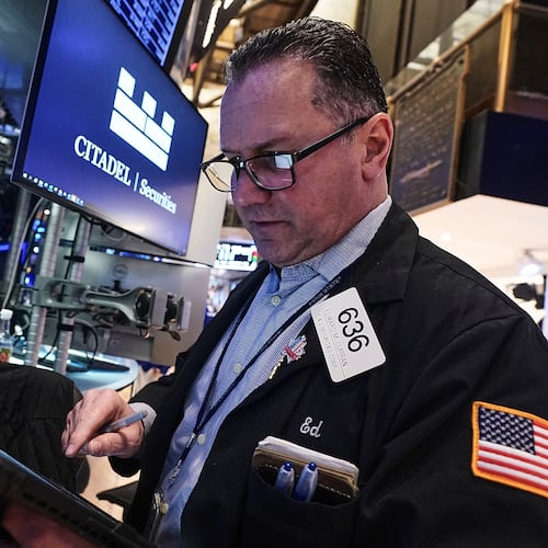 Trader Edward Curran works on the floor of the New York Stock Exchange, Thursday, Jan. 22, 2026. (AP Photo/Richard Drew)