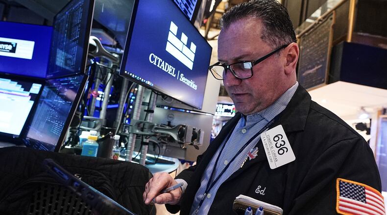 Trader Edward Curran works on the floor of the New York Stock Exchange, Thursday, Jan. 22, 2026. (AP Photo/Richard Drew)
