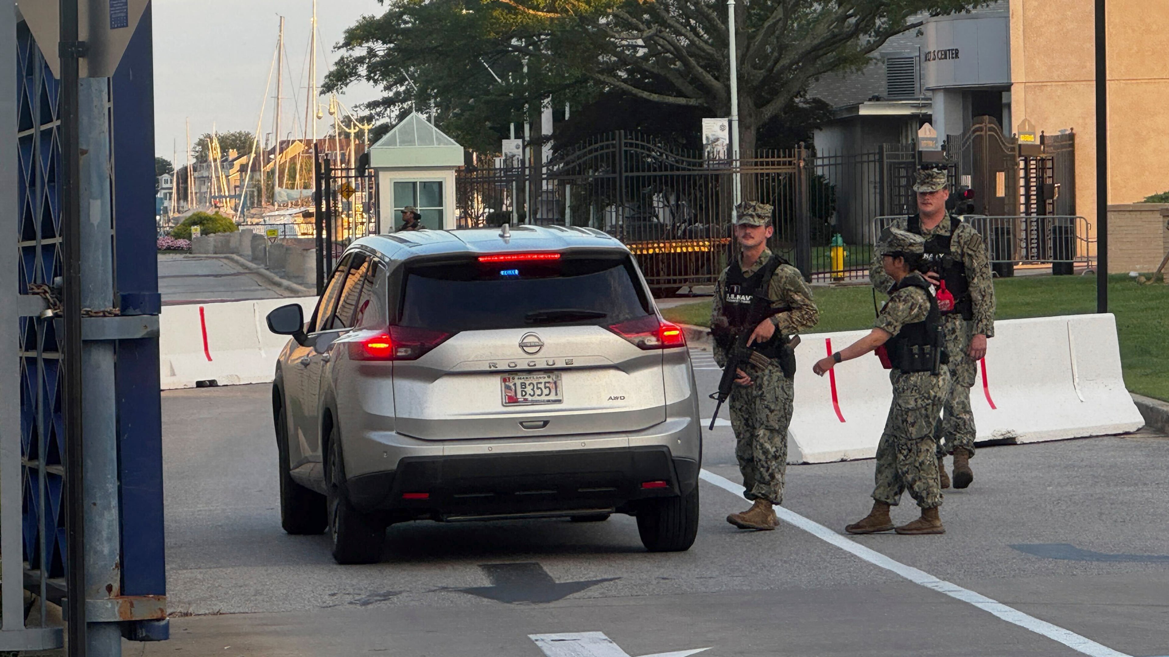 U.S. Navy Security Forces stand at the entrance to Gate 1 at the U.S. Naval Academy in Annapolis, Md., Thursday, Sept. 11, 2025. (Ben Rothstein/The Baltimore Sun via AP)