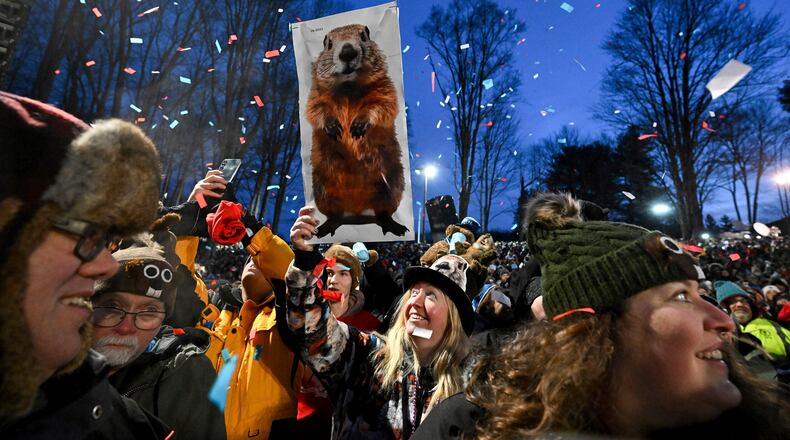 FILE - The crowd watches the festivities while waiting for Punxsutawney Phil, the weather prognosticating groundhog, to come out and make his prediction during the 139th celebration of Groundhog Day on Gobbler's Knob in Punxsutawney, Pa., Feb. 2, 2025. (AP Photo/Barry Reeger, File)