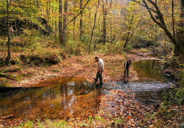 A group surveys a creek in the Dugdown Mountain Corridor, an ecologically rich region in Georgia and Alabama.