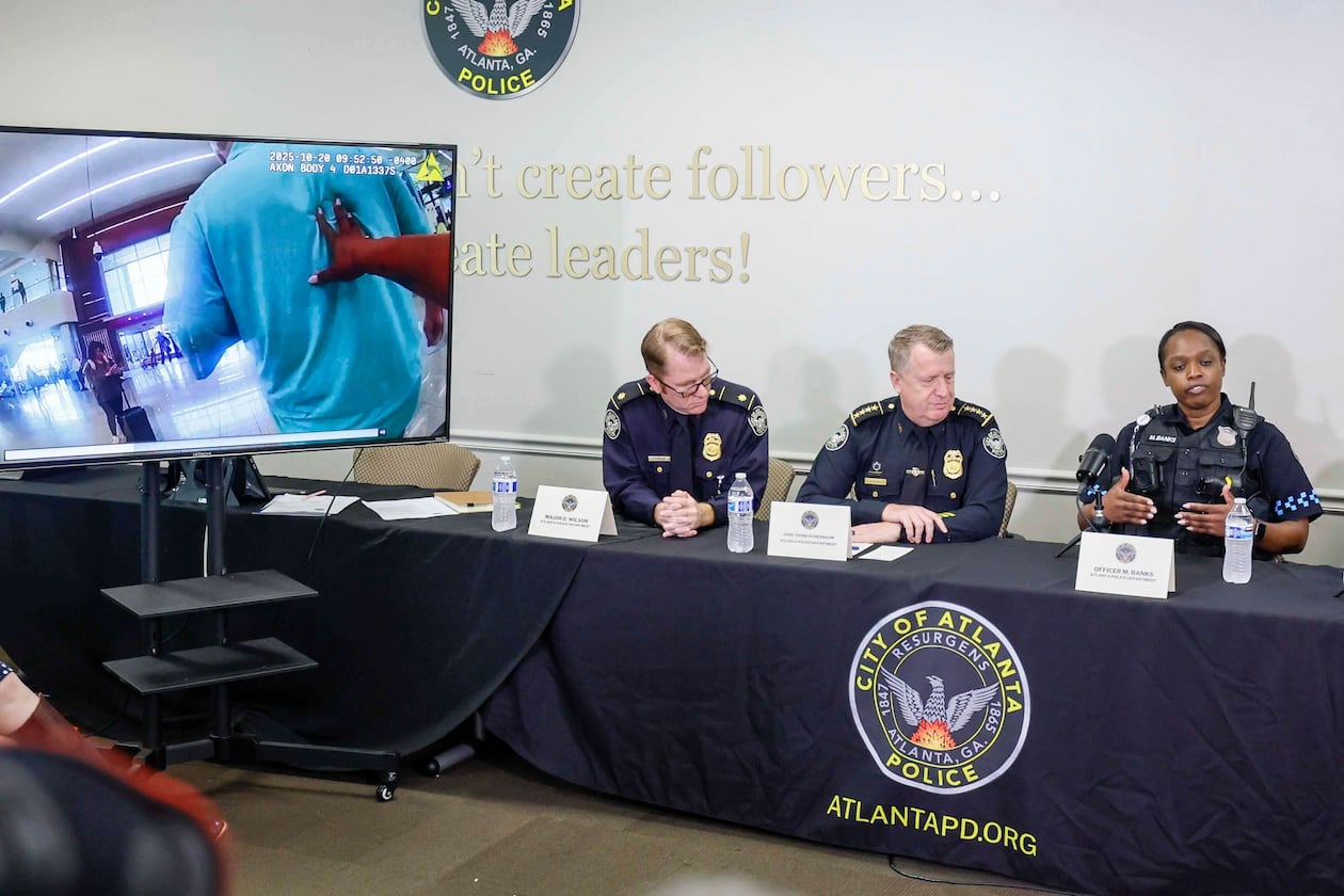 Atlanta police officer Myesha Banks (right) explains the timeline of events that happened Monday at Hartsfield-Jackson Atlanta International Airport. (Miguel Martinez/AJC)
