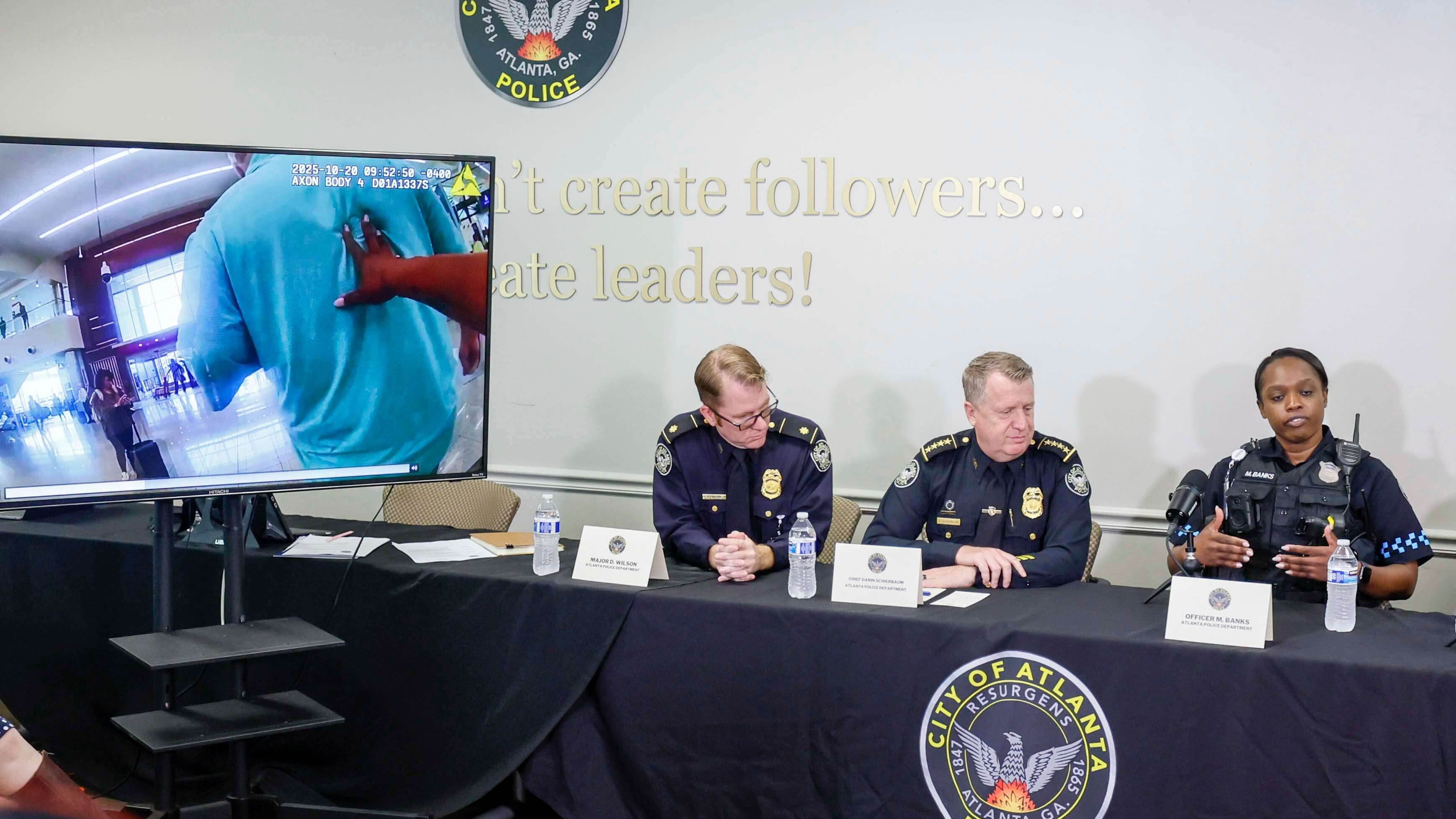 Atlanta police officer Myesha Banks (right) explains the timeline of events that happened Monday at Hartsfield-Jackson Atlanta International Airport. (Miguel Martinez/Atlanta Journal-Constitution)