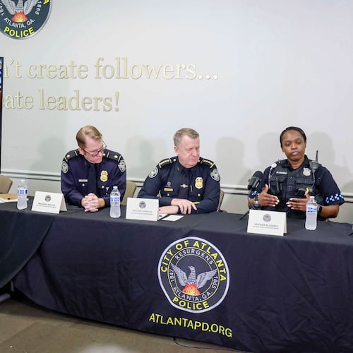 Atlanta police officer Myesha Banks (right) explains the timeline of events that happened Monday at Hartsfield-Jackson Atlanta International Airport. (Miguel Martinez/AJC)