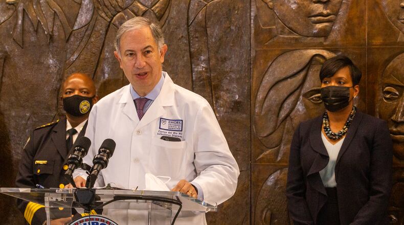 Emory infectious diseases Dr. Carlos Del Rio addresses rising cases of the delta variant during a press conference Tuesday, Aug 3, 2021 at City Hall to address a rise in crime, the recent murder in Piedmont Park and covid delta concerns.  Del Rio is supported by Atlanta Mayor Keisha Lance Bottoms, Deputy Chief Charles Hampton and Atlanta Police Chief Rodney Bryant while addressing city's current issues.  (Jenni Girtman for The Atlanta Journal-Constitution)