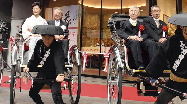 Rickshaws are show at an event in Asakusa, Japan. Rickshaw runners are playing an increasing role as tour guides in Japan. Photo: Japan News-Yomiuri.