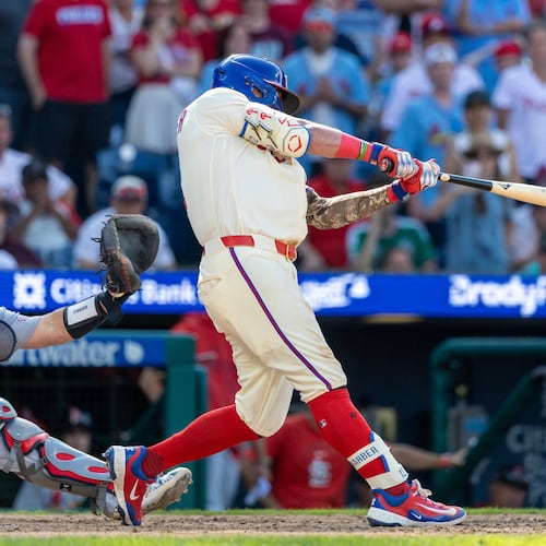 Philadelphia Phillies' Kyle Schwarber hits the winning home run in the ninth inning of a baseball game against the St. Louis Cardinals, Sunday, Aug. 23, 2026, in Philadelphia. (AP Photo/Laurence Kesterson)