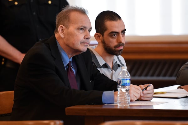 Hadi Matar, right, and public defender Nathaniel Barone listens to Chautauqua County Judge David Foley's sentence in Chautauqua County court in Mayville, N.Y., Friday, May. 16, 2025. (AP Photo/Adrian Kraus)