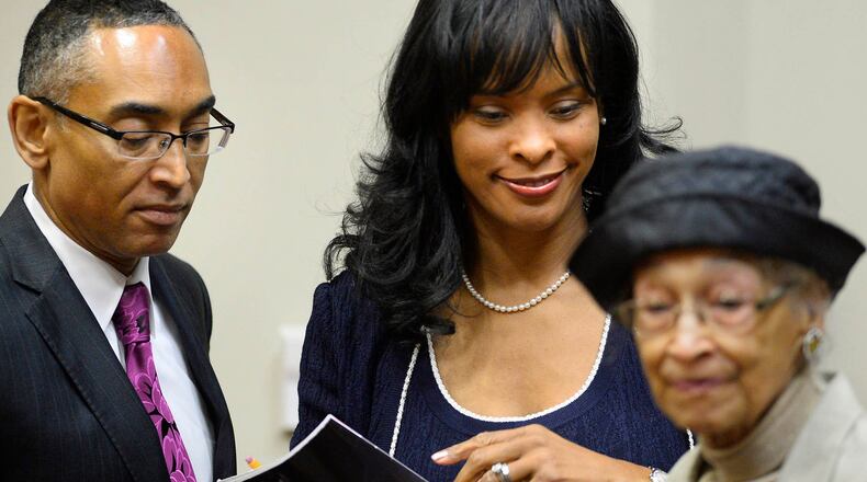Suspended DeKalb County CEO Burrell Ellis, left, leaves court with his wife Philippa and mother Roberta, right, after documents were supplied to help jurors who are meeting for a 10th day of deliberations during a trial in DeKalb County Superior Court on Monday, Oct. 20, 2014 in Decatur, Ga. Ellis is accused of threatening contractors that resisted his requests for campaign contributions. David Tulis / AJC Special