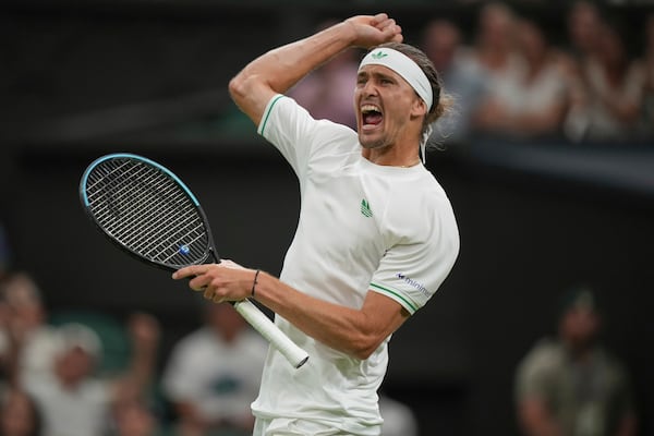 Alexander Zverev of Germany reacts after the second set against Arthur Rinderknech of France in their first round men's singles match at the Wimbledon Tennis Championships in London, Monday, June 30, 2025. (AP Photo/Alastair Grant)