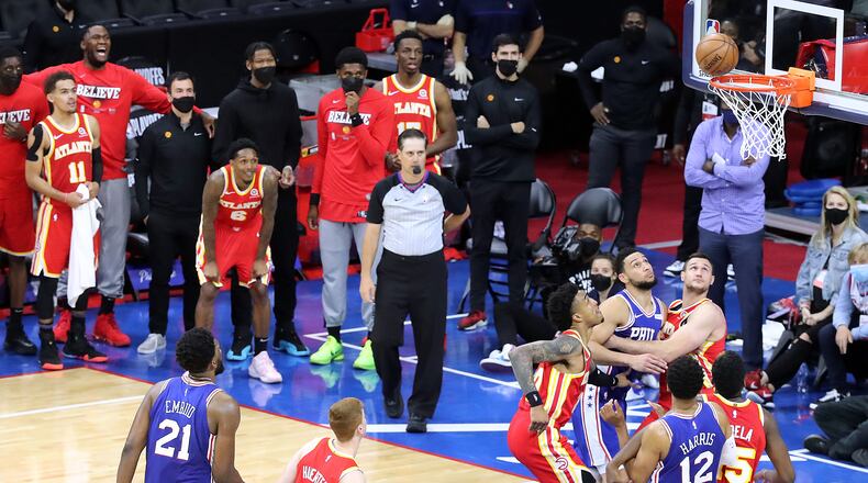061621 Philadelphia: The Atlanta Hawks watch the ball bounce off the rim as Philadelphia 76ers center Joel Embiid misses his second free throw with 10 seconds left in game 5 of their NBA Eastern Conference semifinals series sealing a 109-106 Hawks victory on Wednesday, Jun 16, 2021, in Philadelphia.   “Curtis Compton / Curtis.Compton@ajc.com”