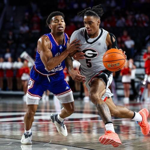 West Georgia guard Malcolm Noel, left, defends against Georgia guard Jeremiah Wilkinson, right, during the second half of an NCAA college basketball game, Monday, Dec. 22, 2025, in Athens, Ga. (Colin Hubbard/AP)