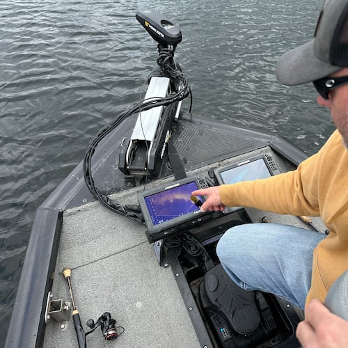 Terry Rehm points out a fish on his forward looking sonar system Saturday, May 23, 2026 in Nowthen, Minn. (AP Photo/Mark Vancleave)