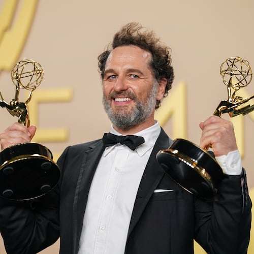 Matthew Rhys poses in the press room with the awards for outstanding lead actor in a limited or anthology series or movie for "The Beast In Me," and outstanding lead actor in a comedy series for "Widow's Bay" during the 78th Emmy Awards on Monday, Sept. 14, 2026, at the JW Marriott in Los Angeles. (Photo by Richard Shotwell/Invision/AP)