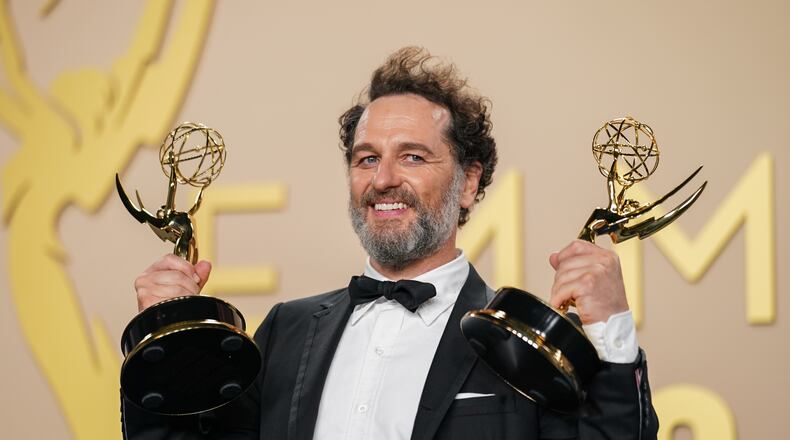 Matthew Rhys poses in the press room with the awards for outstanding lead actor in a limited or anthology series or movie for "The Beast In Me," and outstanding lead actor in a comedy series for "Widow's Bay" during the 78th Emmy Awards on Monday, Sept. 14, 2026, at the JW Marriott in Los Angeles. (Photo by Richard Shotwell/Invision/AP)