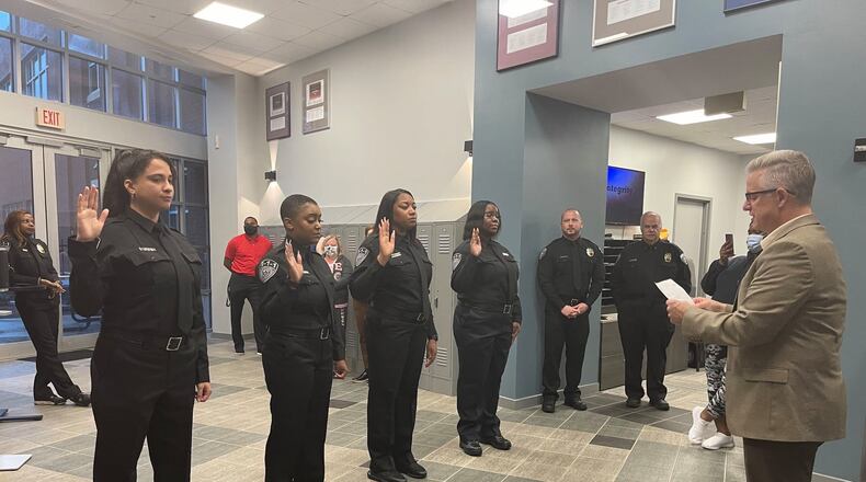 Alpharetta Police Chief John Robison recently swore in four 911 Communications Officers following their successful completion of training. (Courtesy City of Alpharetta)