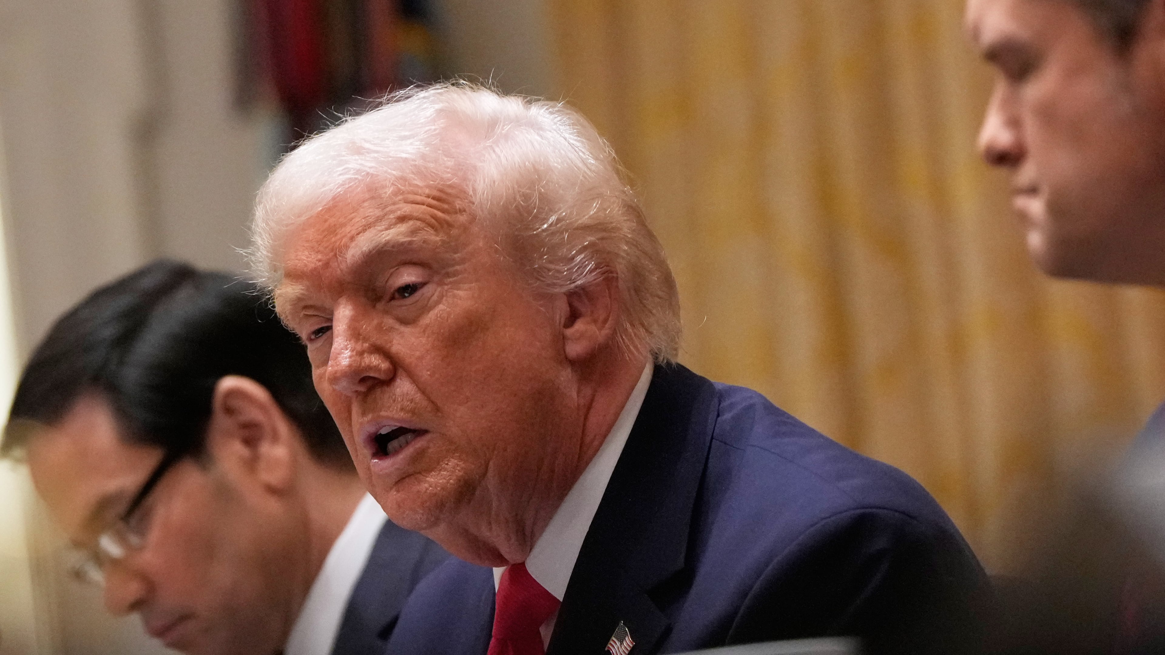 President Donald Trump speaks during a Cabinet meeting at the White House, Tuesday, Dec. 2, 2025, in Washington, with Secretary of State Marco Rubio, seated left and Defense Secretary Pete Hegseth, seated left. (AP Photo/Julia Demaree Nikhinson)