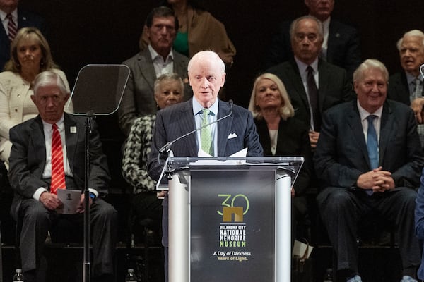 Former Oklahoma Governor Frank Keating speaks to guest during the 30th anniversary memorial service for the victims of the 1995 Oklahoma City bombing, in Oklahoma City, Saturday, April 19, 2025. (AP Photo/Alonzo Adams)