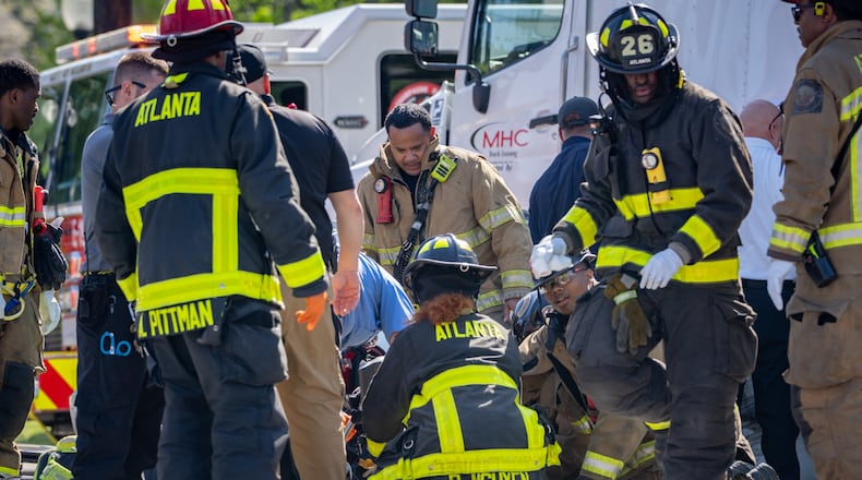 Atlanta firefighters on scene of a crash on Piedmont Avenue at Monroe Drive