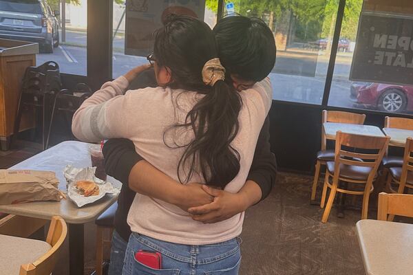 Juan Carlos Lopez Gomez, 20, a U.S. citizen, hugs his mother in Tallahassee, Fla., after his April 17, 2025 release from jail where he was being held by federal immigration authorities.  (Thomas Kennedy via AP)