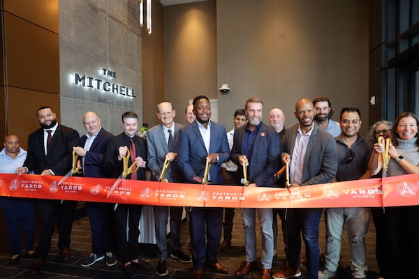 City officials and Centennial Yards employees attend the ribbon cutting and unveiling of The Mitchell apartments on Thursday, Sept. 4, 2025. The building is Centennial Yards’ first apartment tower. (Natrice Miller/AJC)