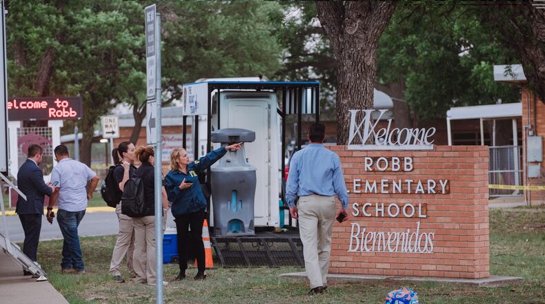 Law enforcement outside Robb Elementary School in Uvalde, Texas, where a gunman killed at least 18 children and a teacher on Tuesday, May 24, 2022. The attack in this rural town west of San Antonio was the deadliest American school shooting since the massacre at Sandy Hook a decade ago. (Christopher Lee/The New York Times)