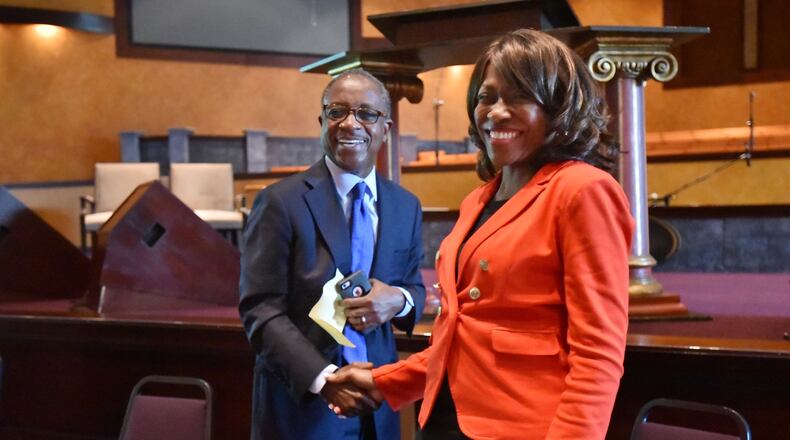 DeKalb County CEO candidates Michael Thurmond and Connie Stokes greet during candidate forum presented by DeKalb For Seniors Inc. at Salem Bible Church in Lithonia on Thursday. The May 24 primary election will give voters an opportunity to elect a wide variety of candidates to represent the county. HYOSUB SHIN / HSHIN@AJC.COM
