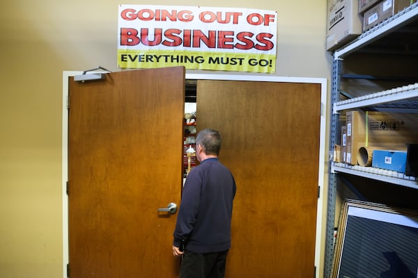 David England walks into the store's workshop. He said it will take a few months to figure out who he is without England Piano. (Abbey Cutrer/AJC)