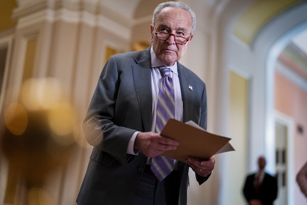 Senate Minority Leader Chuck Schumer, D-N.Y., looks over notes as Senate Republicans work to cancel $9.4 billion in previously approved spending targeted by DOGE, at the Capitol in Washington, Tuesday, July 15, 2025. (AP Photo/J. Scott Applewhite)