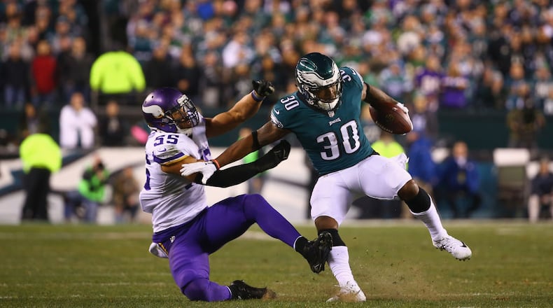 PHILADELPHIA, PA - JANUARY 21: Corey Clement #30 of the Philadelphia Eagles uses a stiff arm against Anthony Barr #55 of the Minnesota Vikings during the second quarter in the NFC Championship game at Lincoln Financial Field on January 21, 2018 in Philadelphia, Pennsylvania. (Photo by Mitchell Leff/Getty Images)