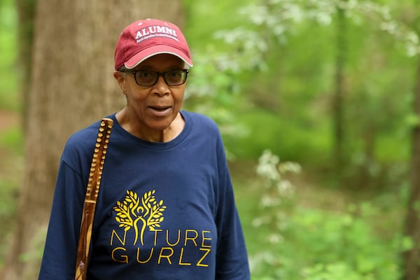 Kate Little, a member of the Nature Gurlz, walks with others along the trails at Cascade Springs Nature Preserve on April 22, 2025, in Atlanta. (Jason Getz/AJC)