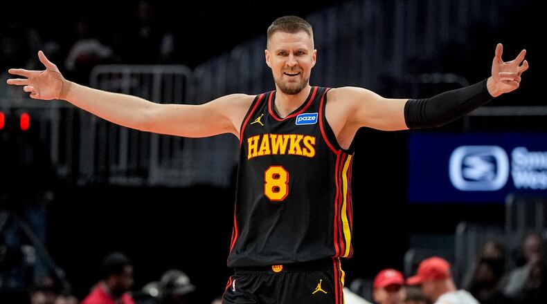 Center Kristaps Porzingis — pictured celebrating during the Hawks' win over the Raptors on Nov. 7 — finished with 13 points and six assists in Atlanta's 133-100 win over Sacramento on Wednesday, Nov. 12, 2025. The Hawks have a three-game winning streak, their longest of the season. (Mike Stewart/AP)